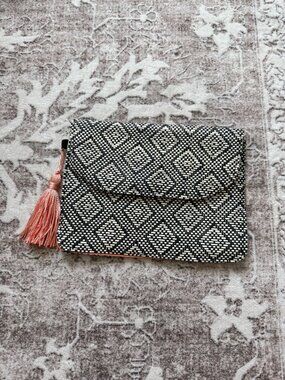 Woven envelope clutch bag